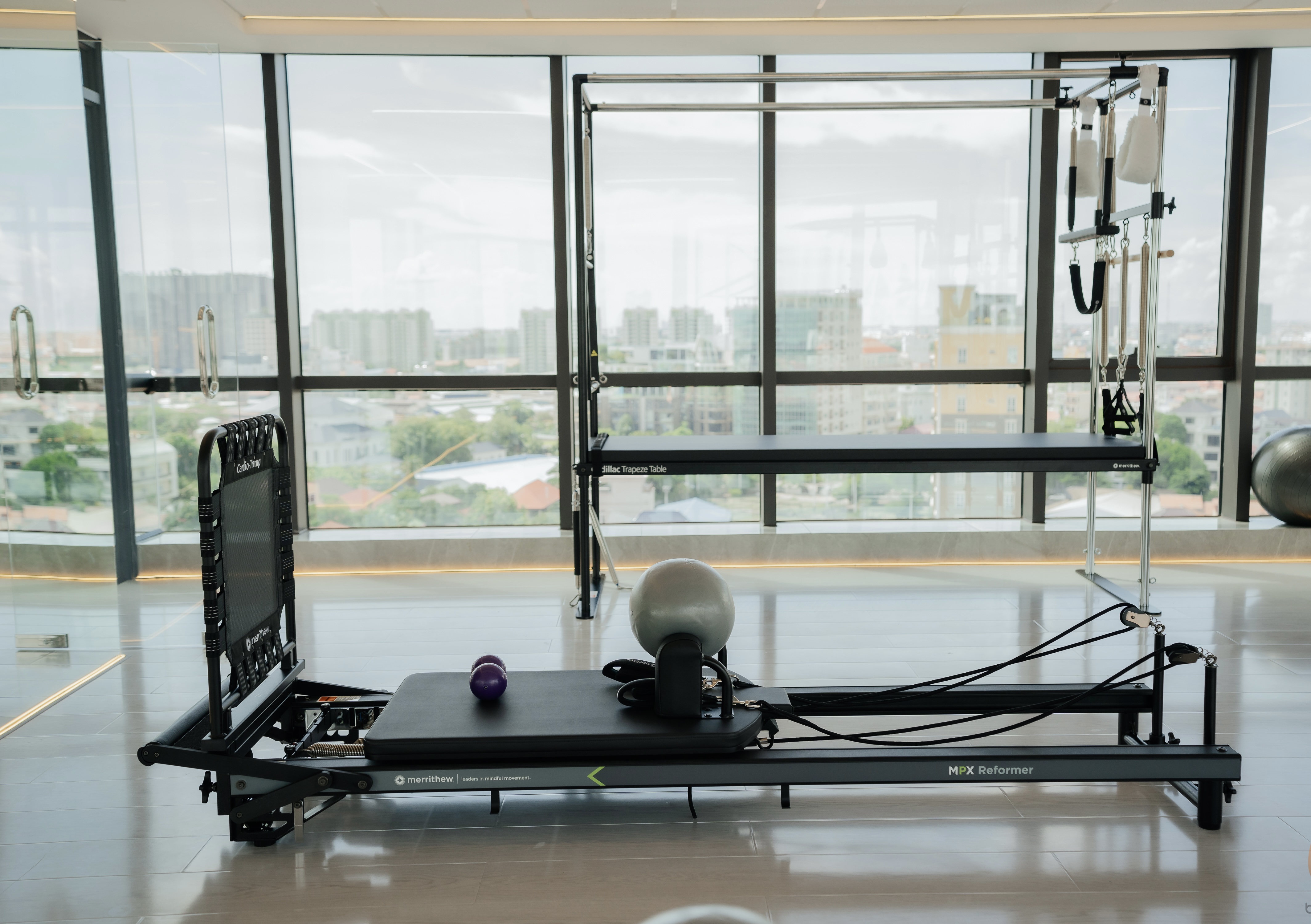 K.KMK Pilates Merrithew equipment floor overlooking Phnom Penh