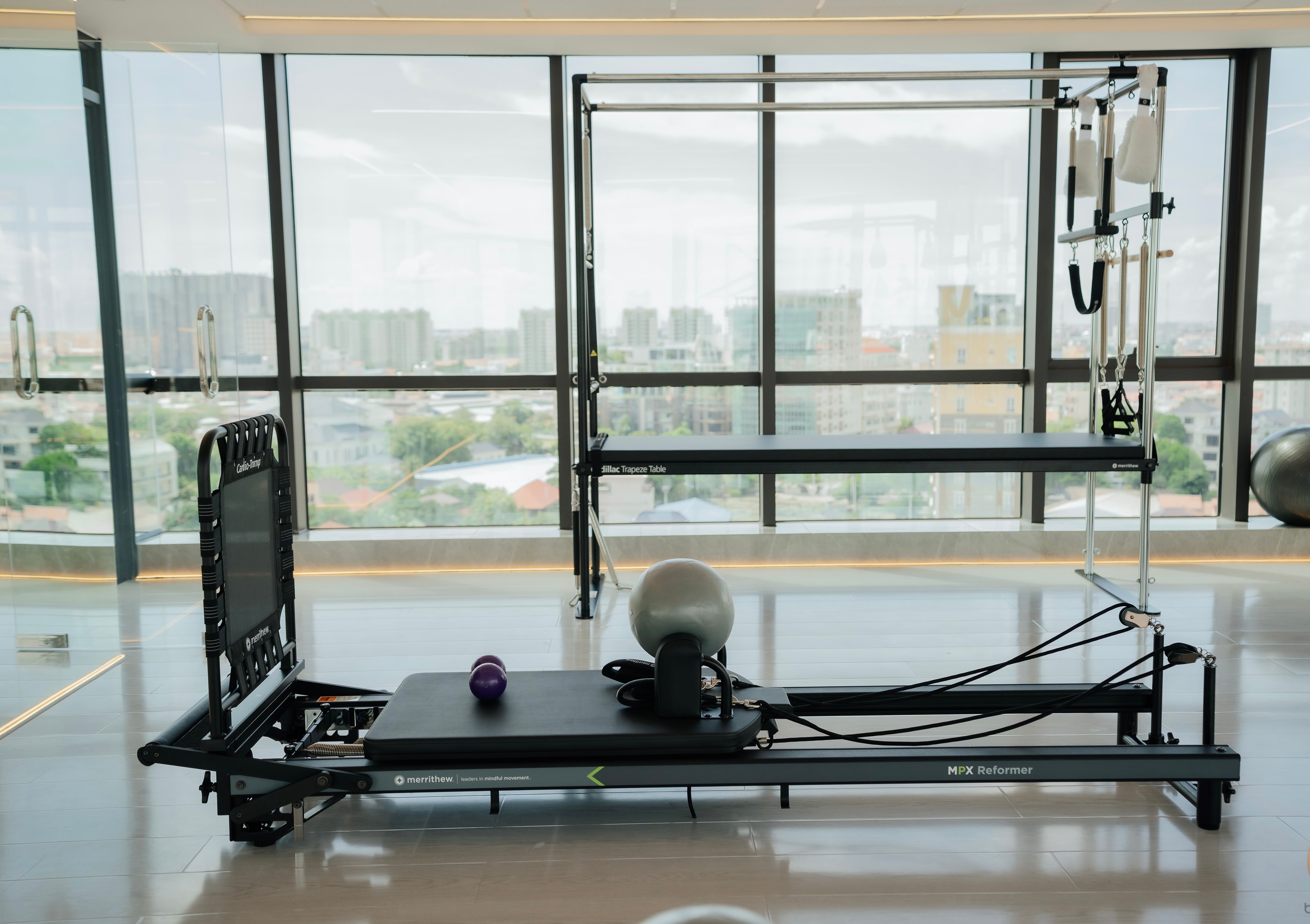 KMK Pilates Merrithew equipment floor overlooking Phnom Penh